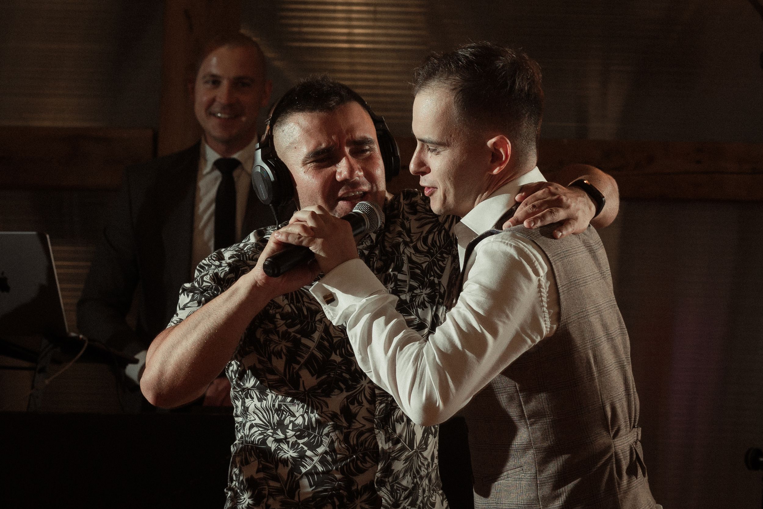 A series of candid moments between couples dancing close together in dim lighting at what appears to be a wedding reception.