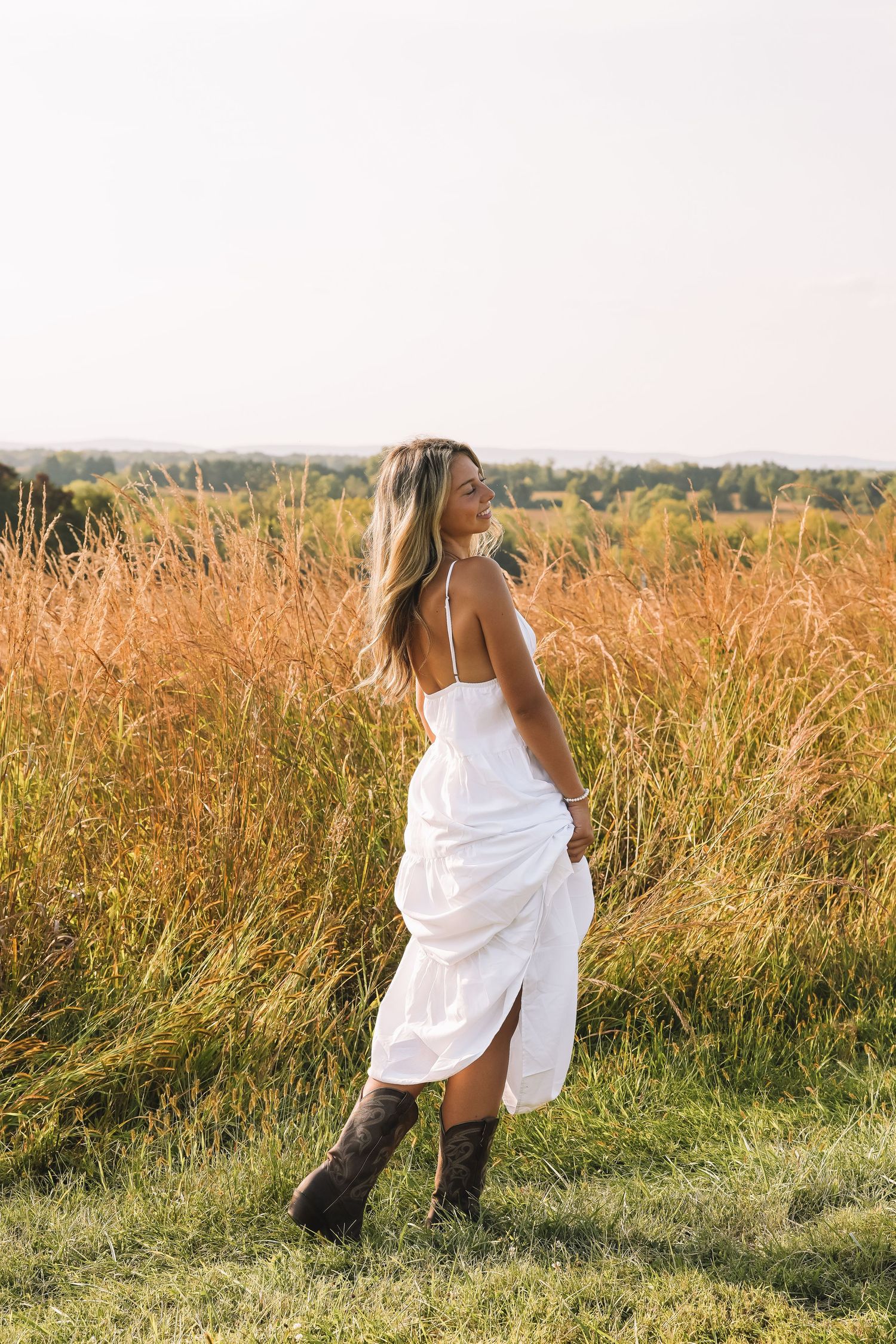Graduation portrait session in the Manassas, Virginia - beautiful tall grass field | Senior photos by Alina Phillips Photography.