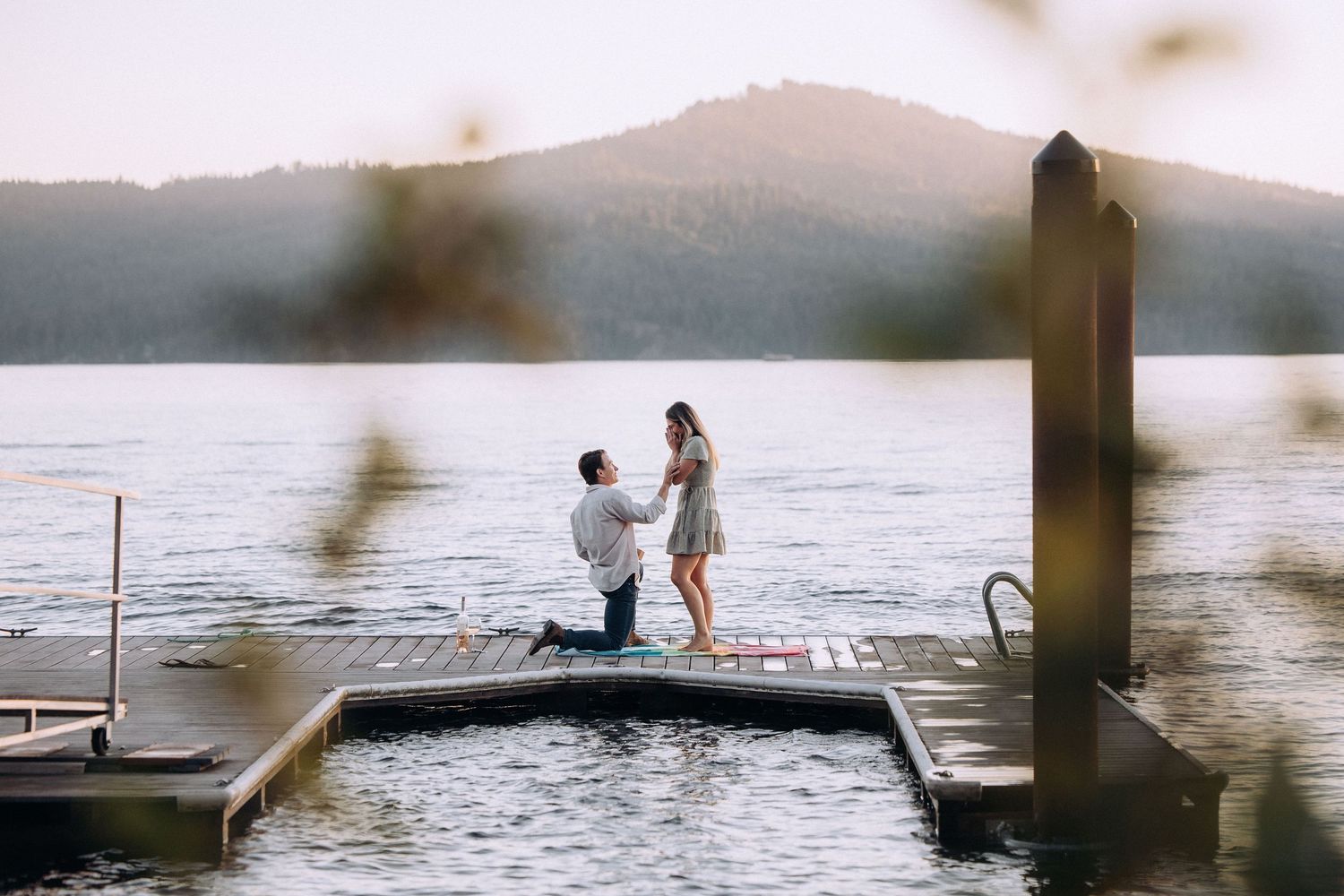 Engaged couple during a romantic engagement session on Coeur d’Alene Lake in North Idaho