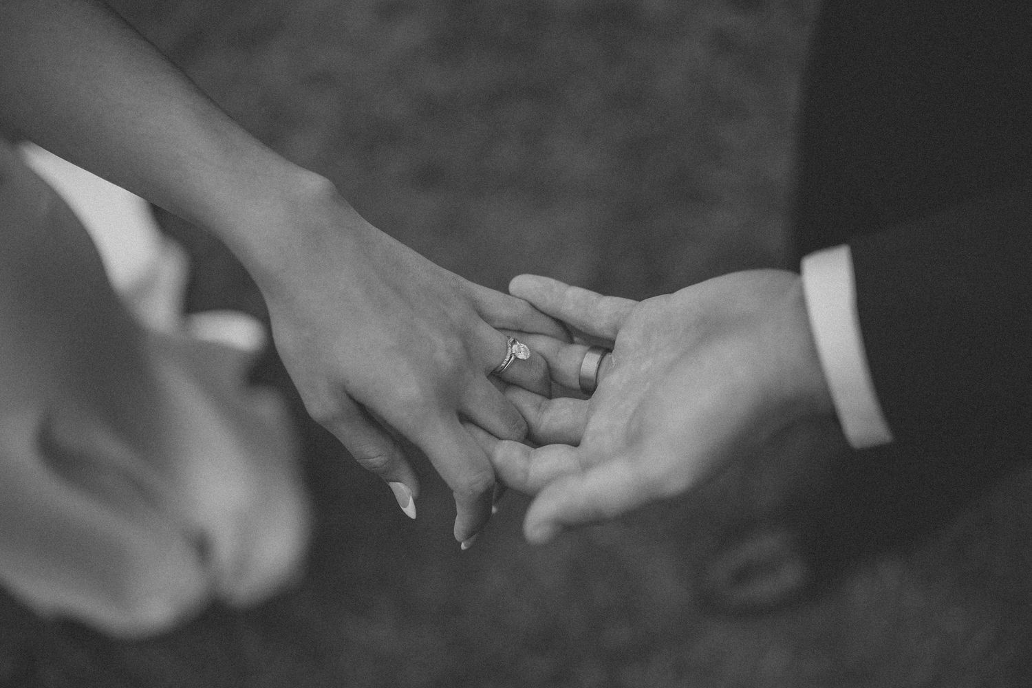 Bride and groom holding hands during their outdoor wedding in North Idaho