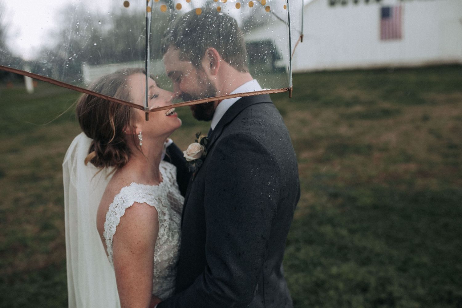 A romantic rainy wedding day in Idaho with the couple under an umbrella