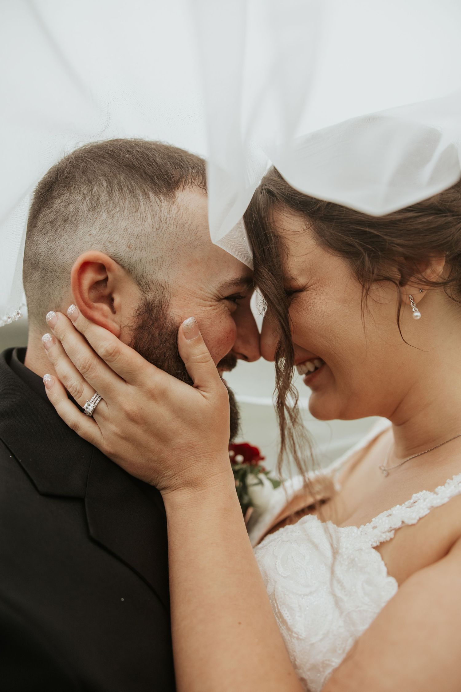 A tender newlywed couple sharing intimate close-up moments in a series of romantic wedding day photos.
