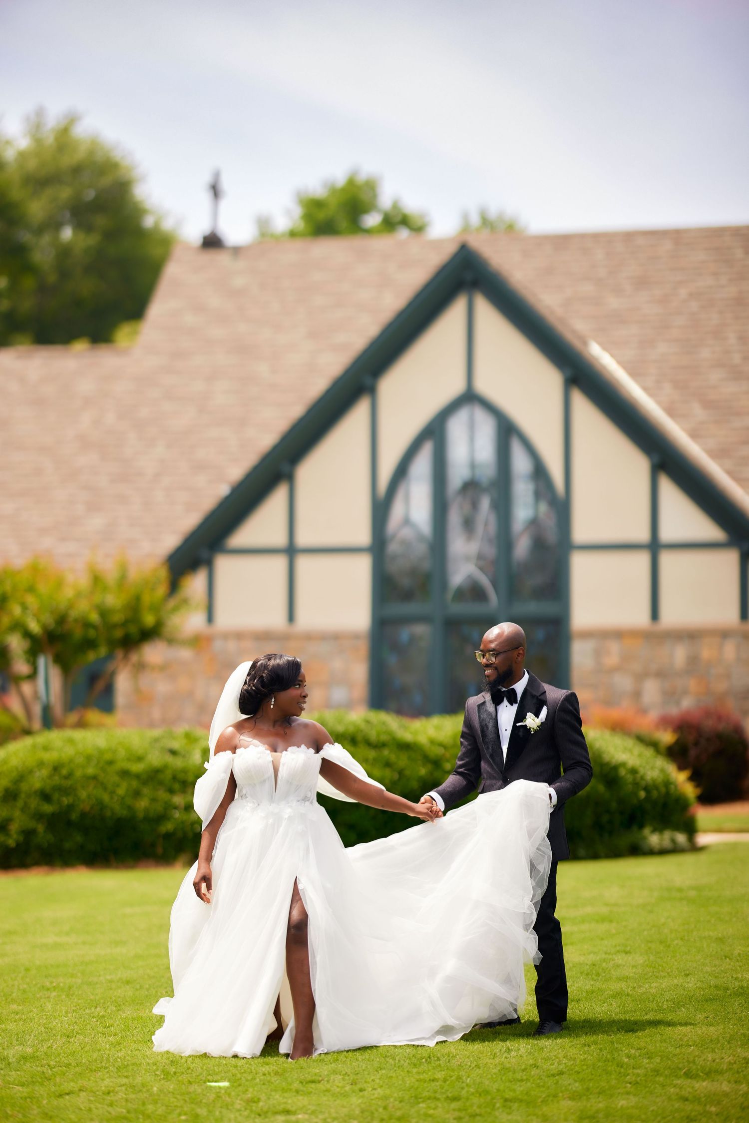 A romantic outdoor wedding photo sequence shows a flowing white dress twirling on a lush green lawn with a church in the background.