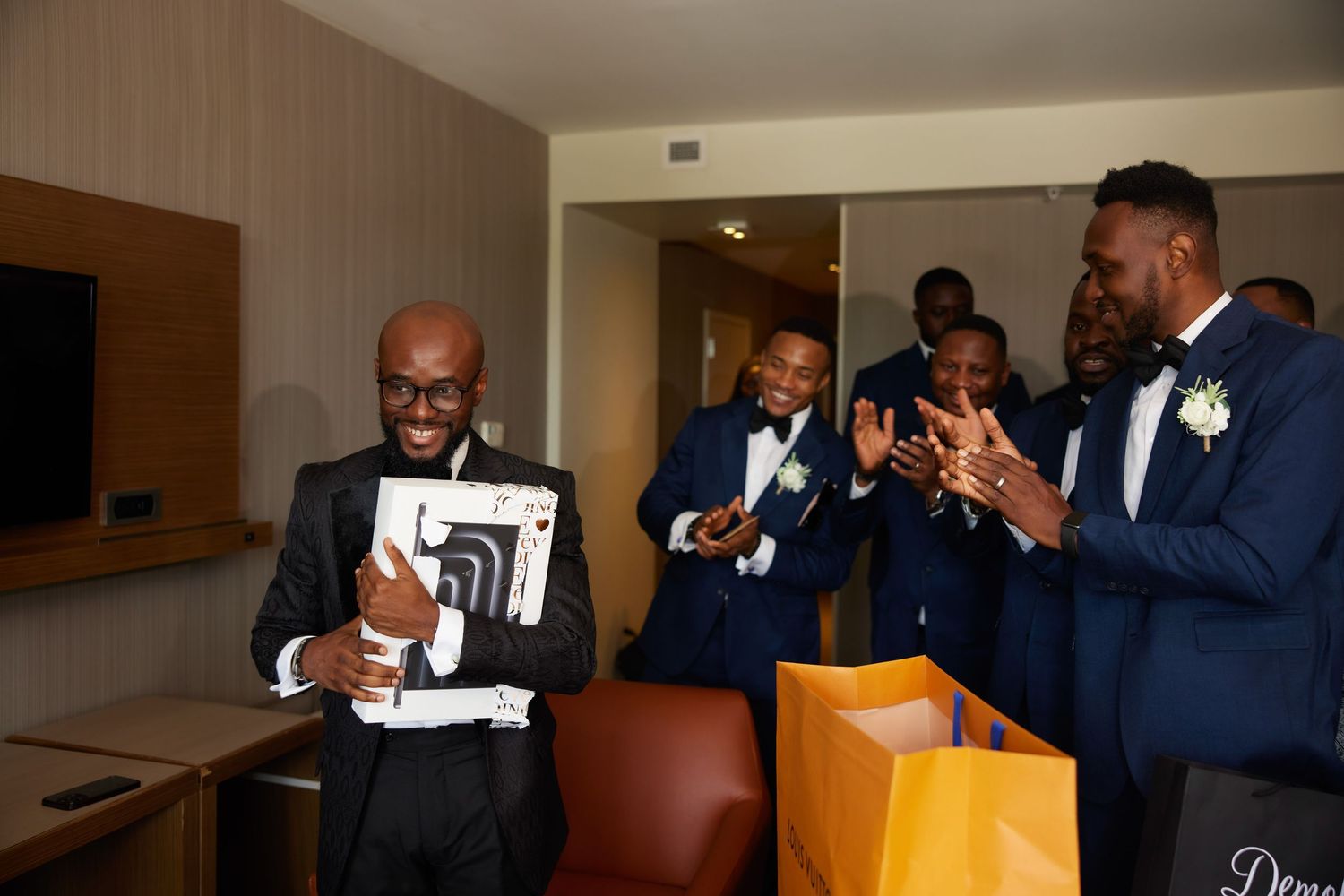 A montage sequence showing men in navy suits preparing and sharing emotional moments in a church setting.