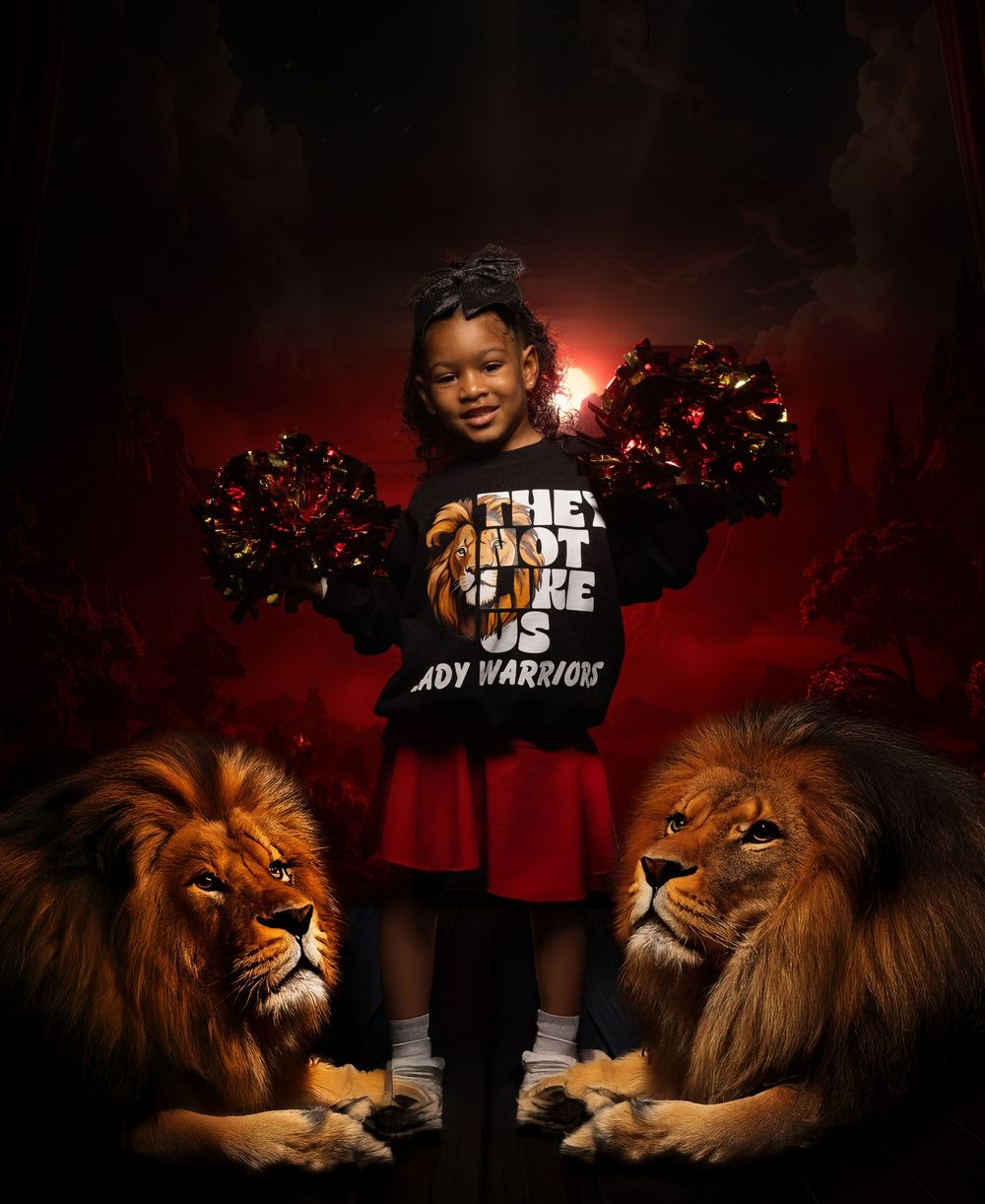 Cheerleader poses between two majestic lions while holding red pom poms.
