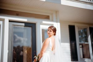 A romantic wedding ceremony kiss captured through multiple frames in a sunlit venue with large windows.