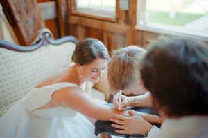 Sequence showing a wedding couple sharing intimate moments in a naturally lit room with windows.