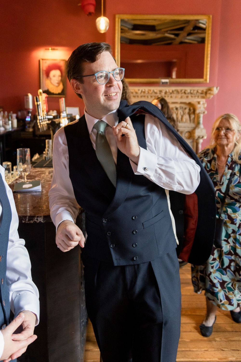 Wedding reception dance floor with guests celebrating in formal attire.