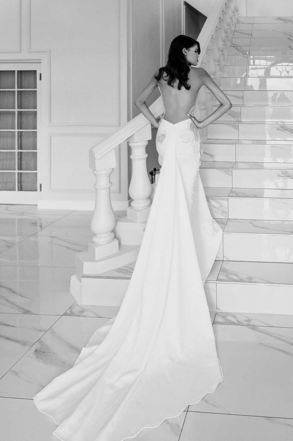 Sequence of elegant white bridal gown photos showcasing flowing train detail in black and white.