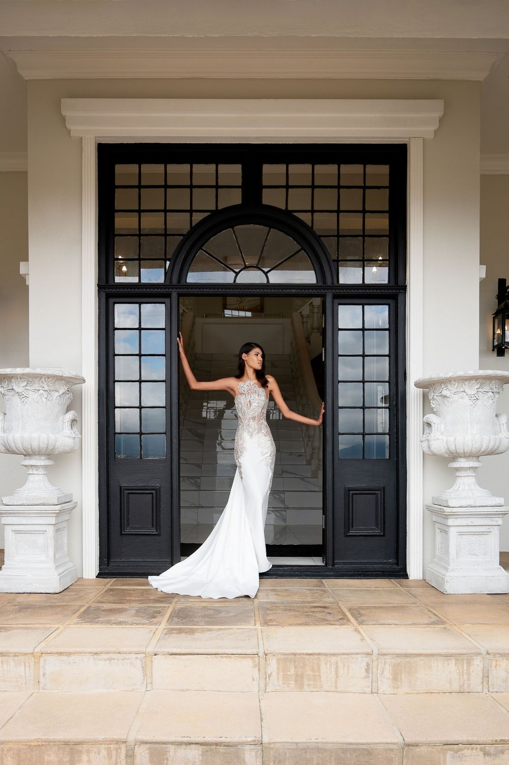 A series of artistic bridal portraits showing a flowing white wedding gown against elegant black double doors.