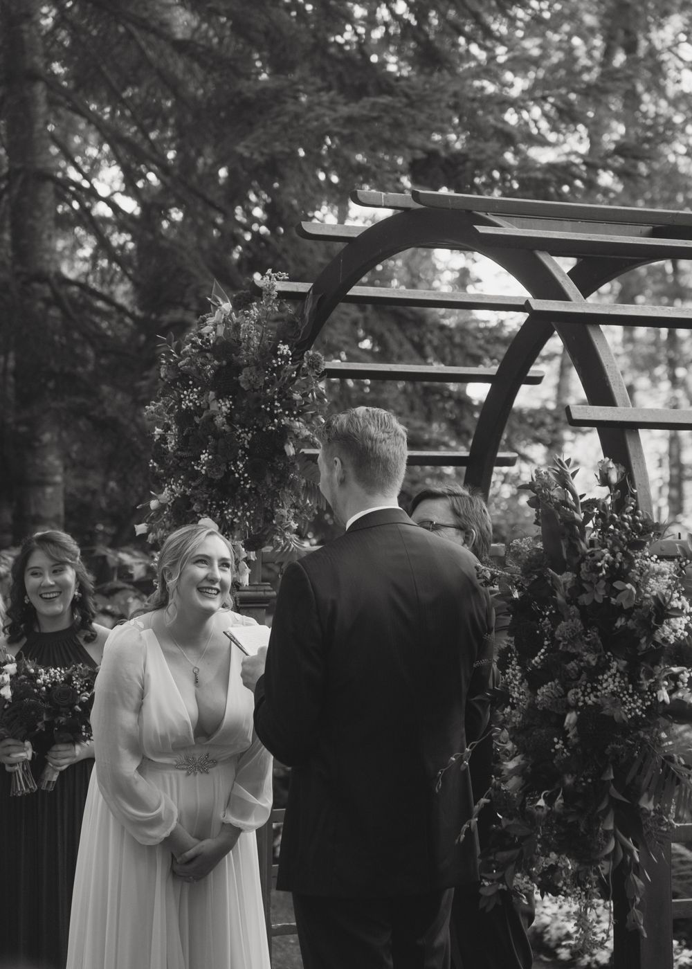 A series of wedding photos showing a couple walking together in a garden setting with trees in the background.