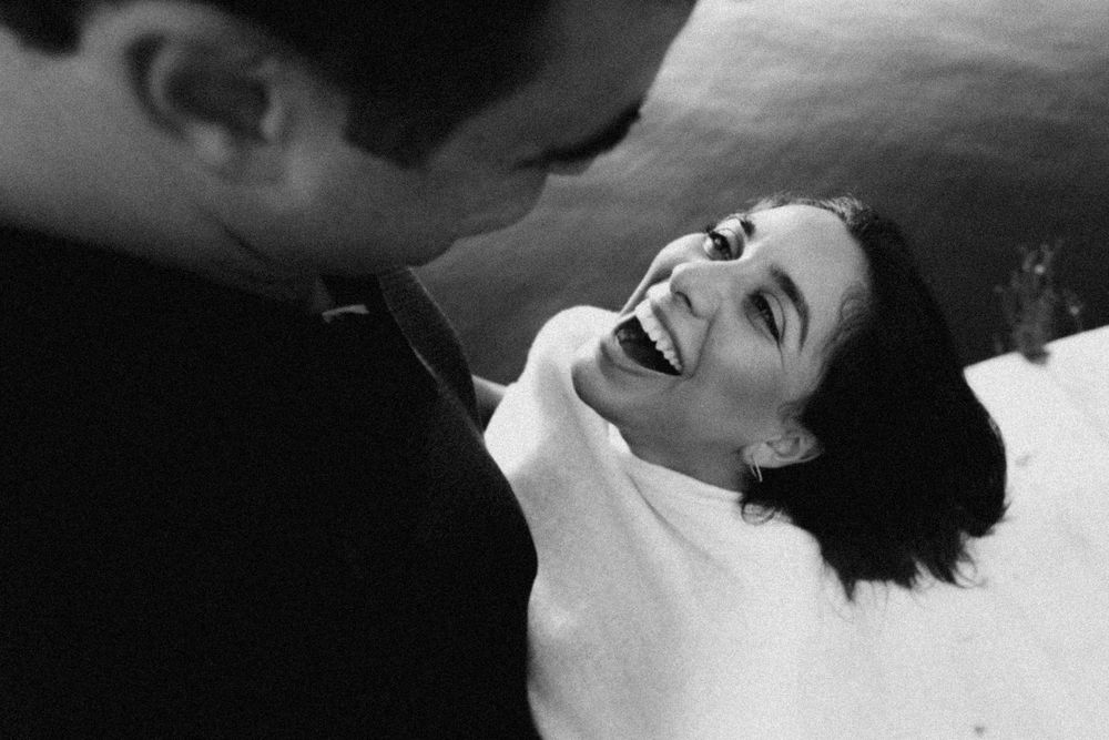 Intimate black and white photo series capturing tender romantic moments between two people.
