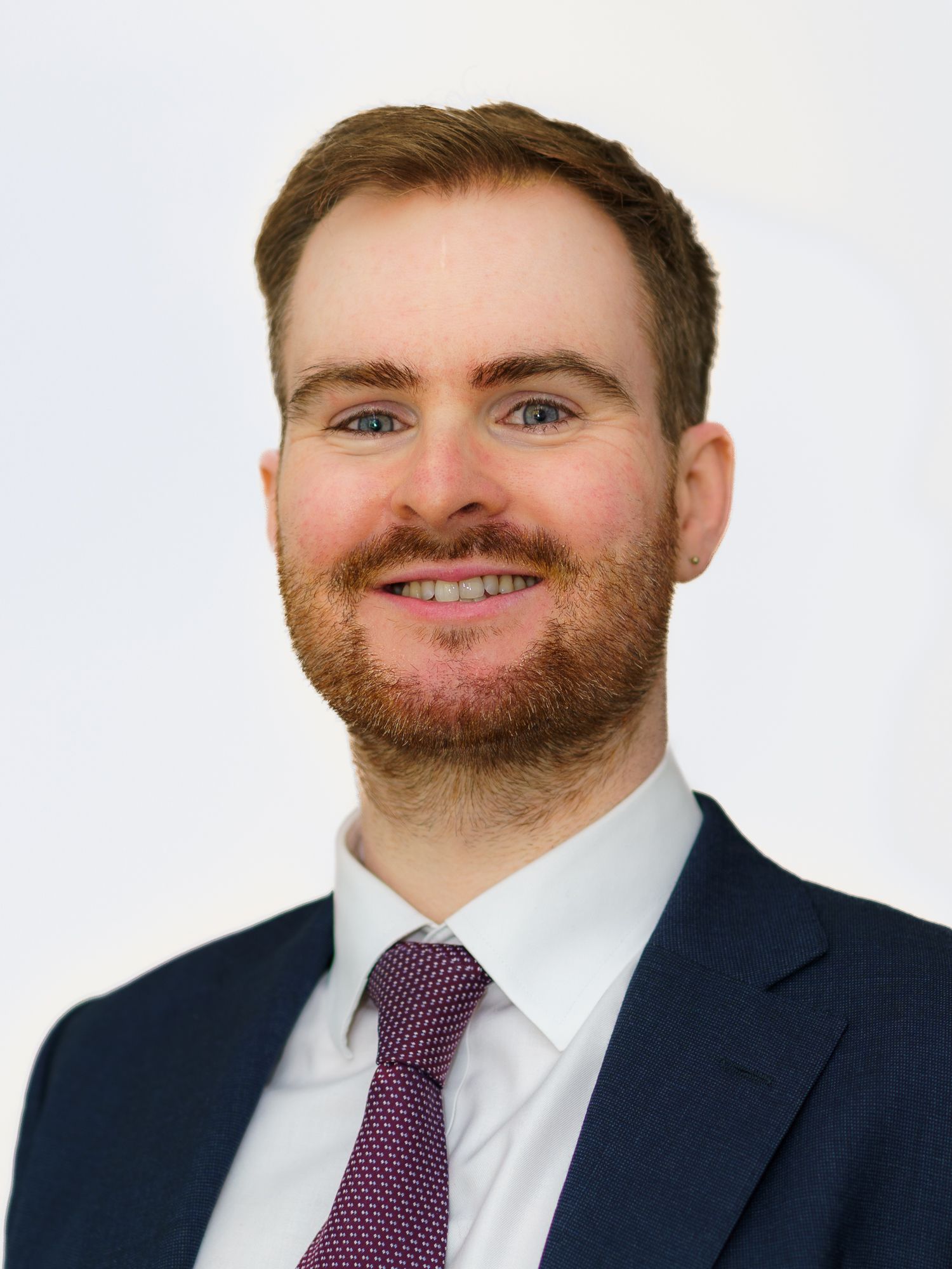 Young man smiling for his headshot