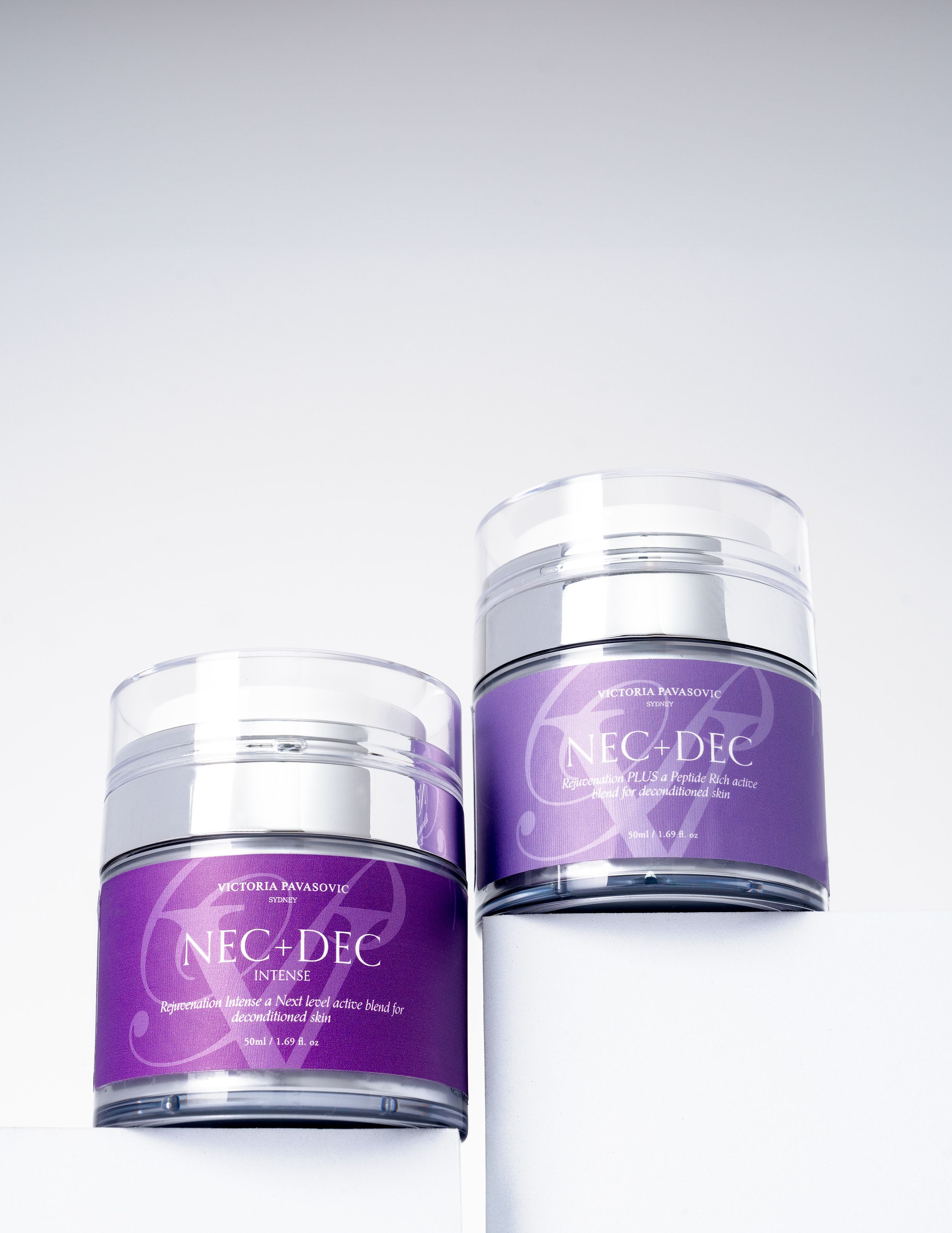 Purple and silver cosmetic jars with Neo Dec branding shown from different angles against white background.