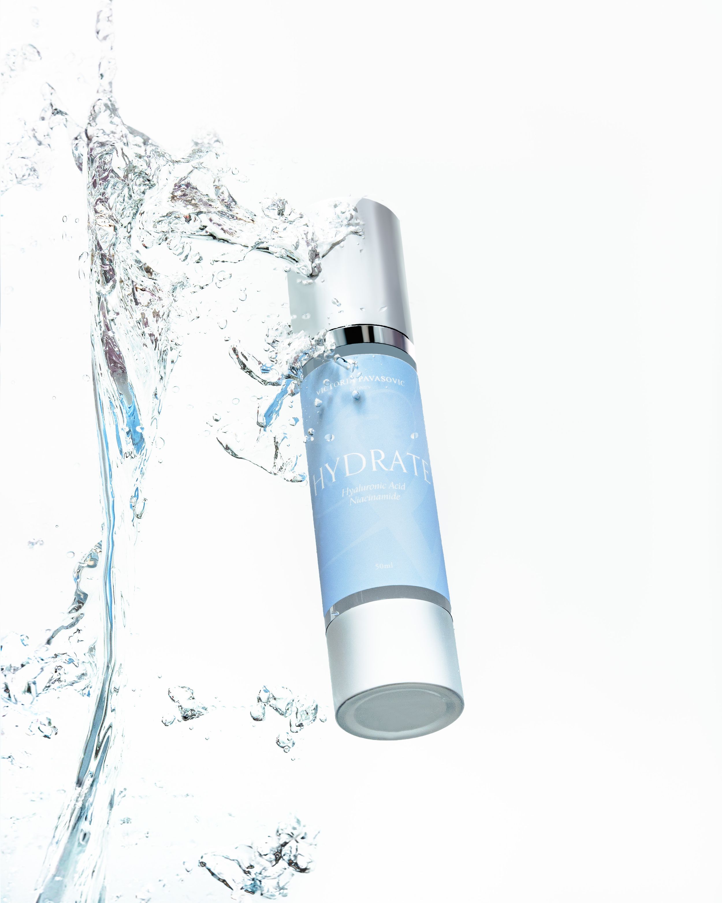 Water splashing around light blue moisturizer bottles against a white background.