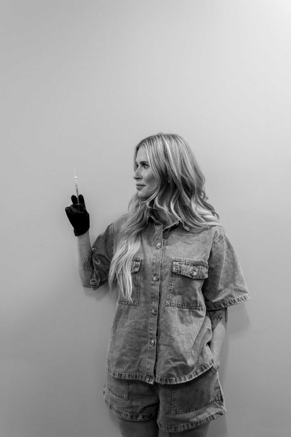 Artistic black and white portrait series showing movement in denim jacket.