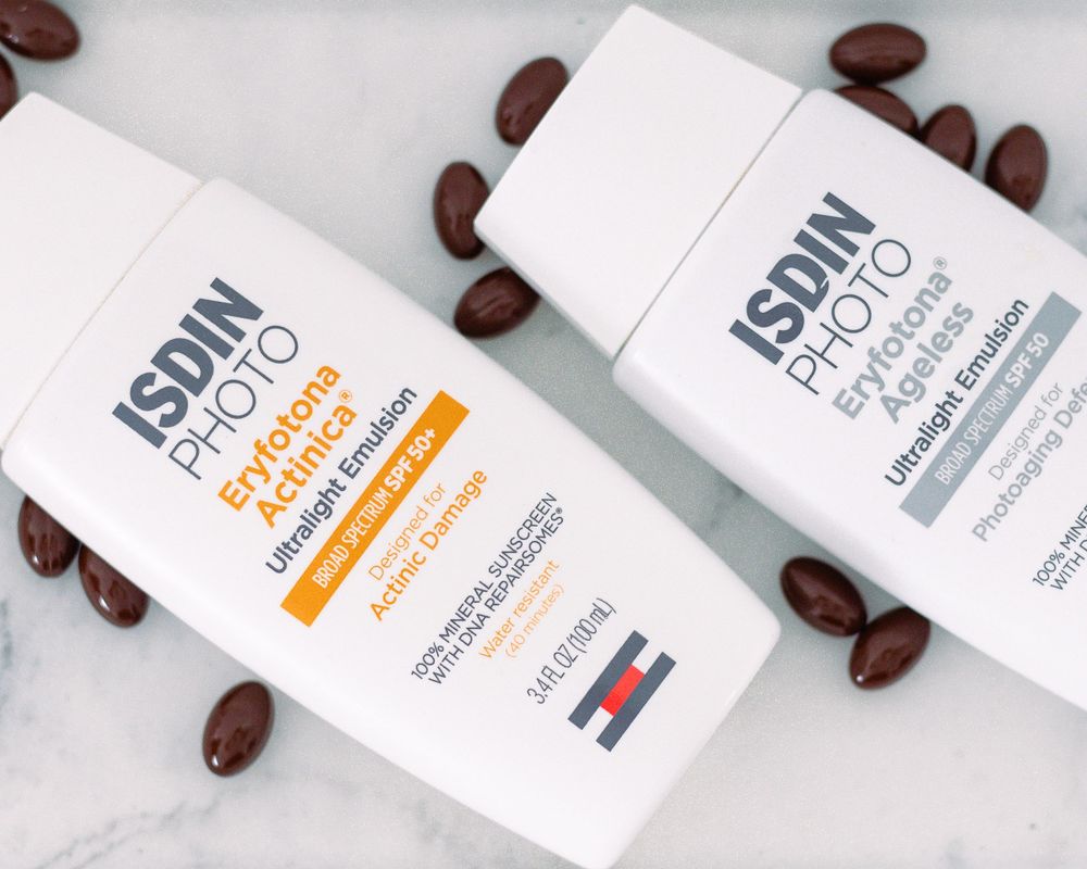Row of skincare product boxes with coffee beans scattered around them.