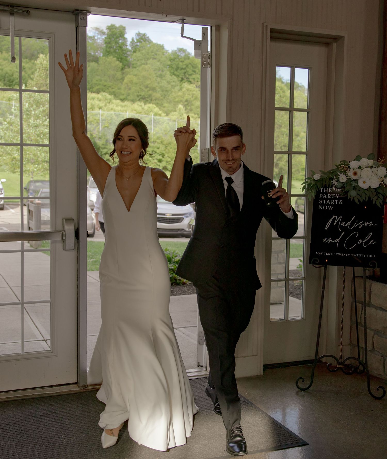 A series of candid reception photos showing celebratory dancing in a bright windowed venue.