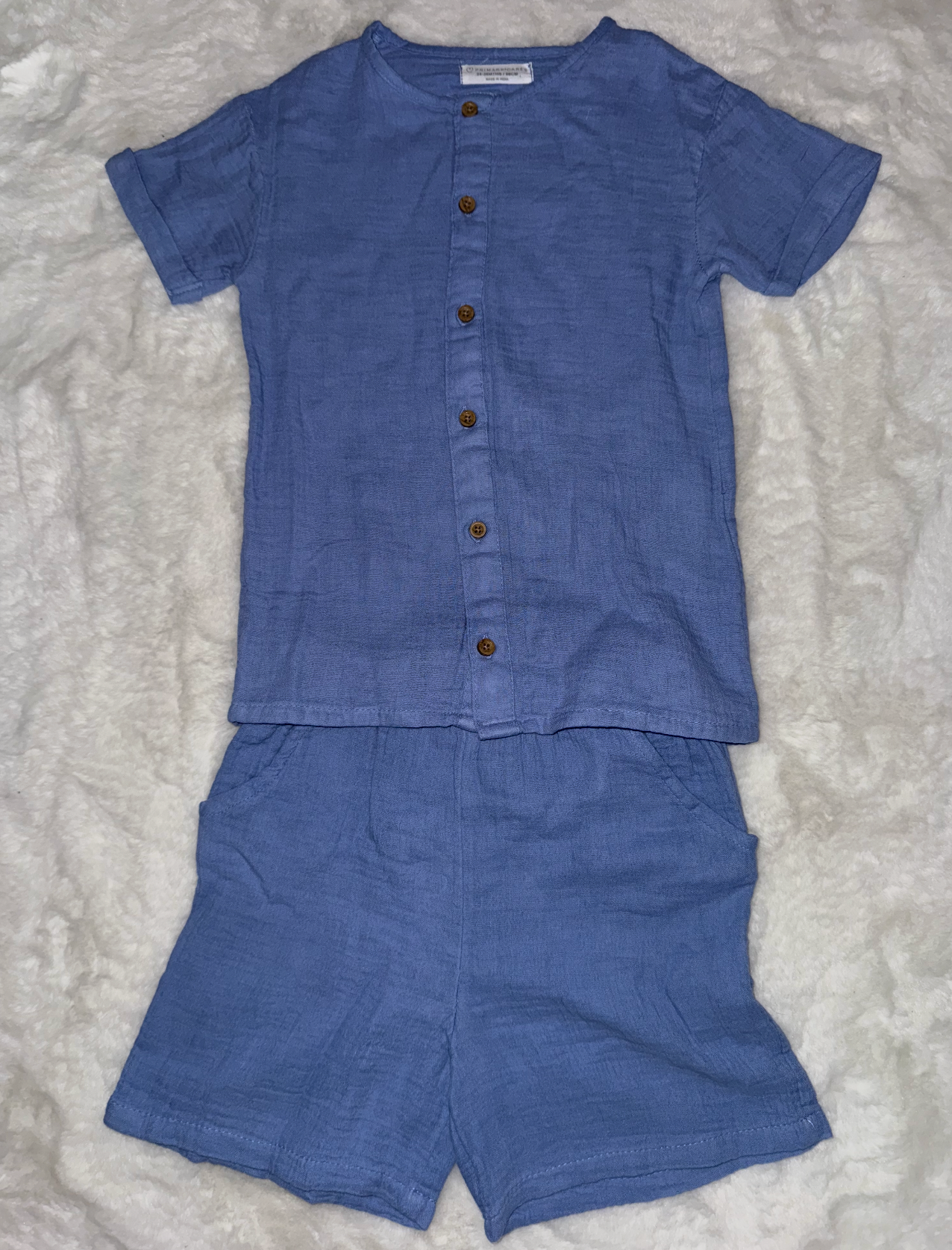 Navy blue linen baby two-piece set with buttons and short sleeves photographed from multiple views.