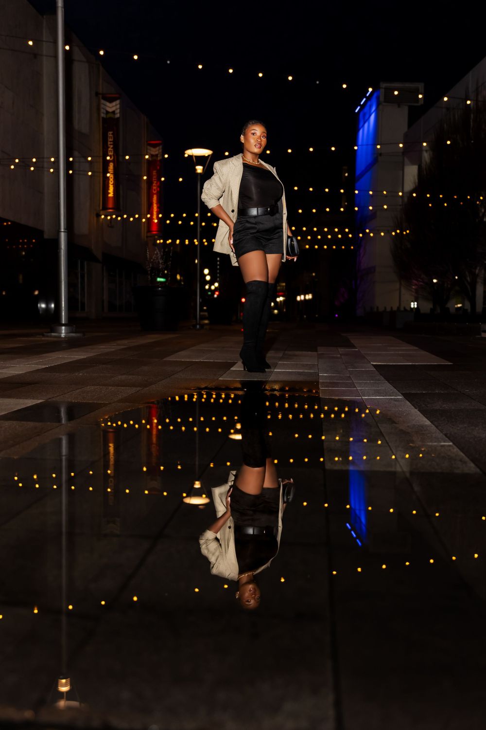 Night scene with decorative ground lighting creating a dramatic urban atmosphere.