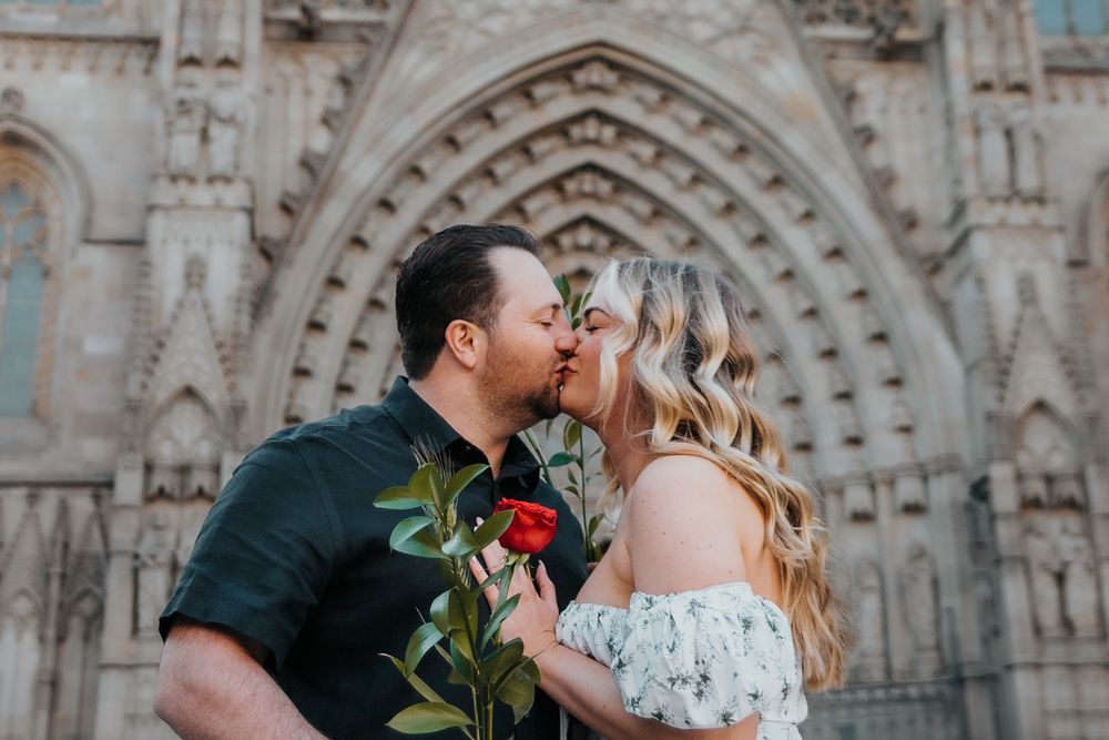 Expecting couple walking through Old City Barcelona