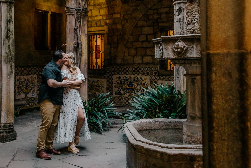 Deane & Joseph holding hands in historic Barcelona