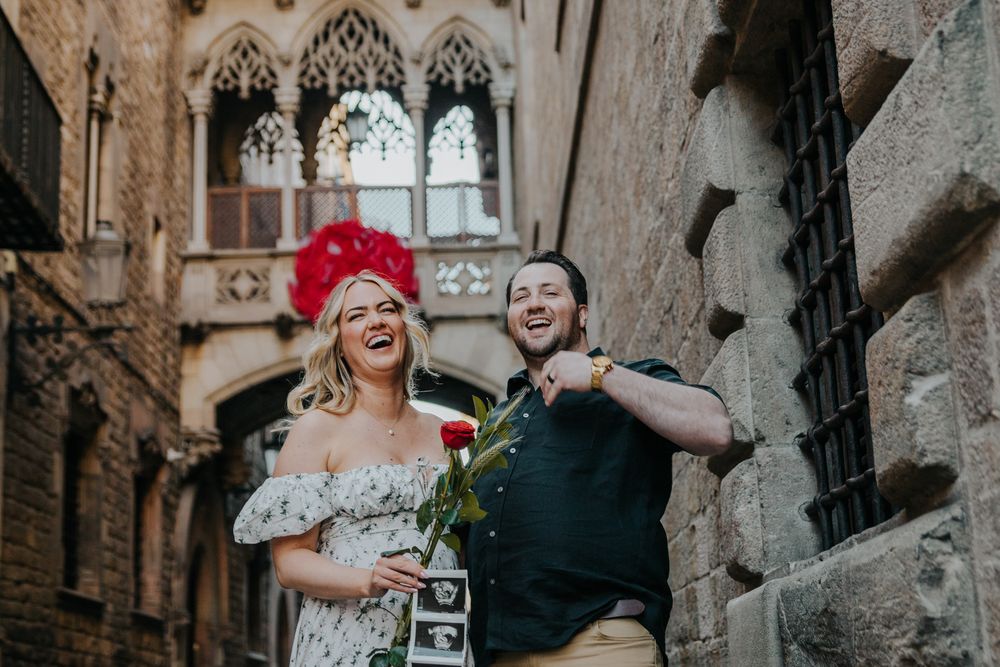 Romantic couple pose in El Born for baby announcement