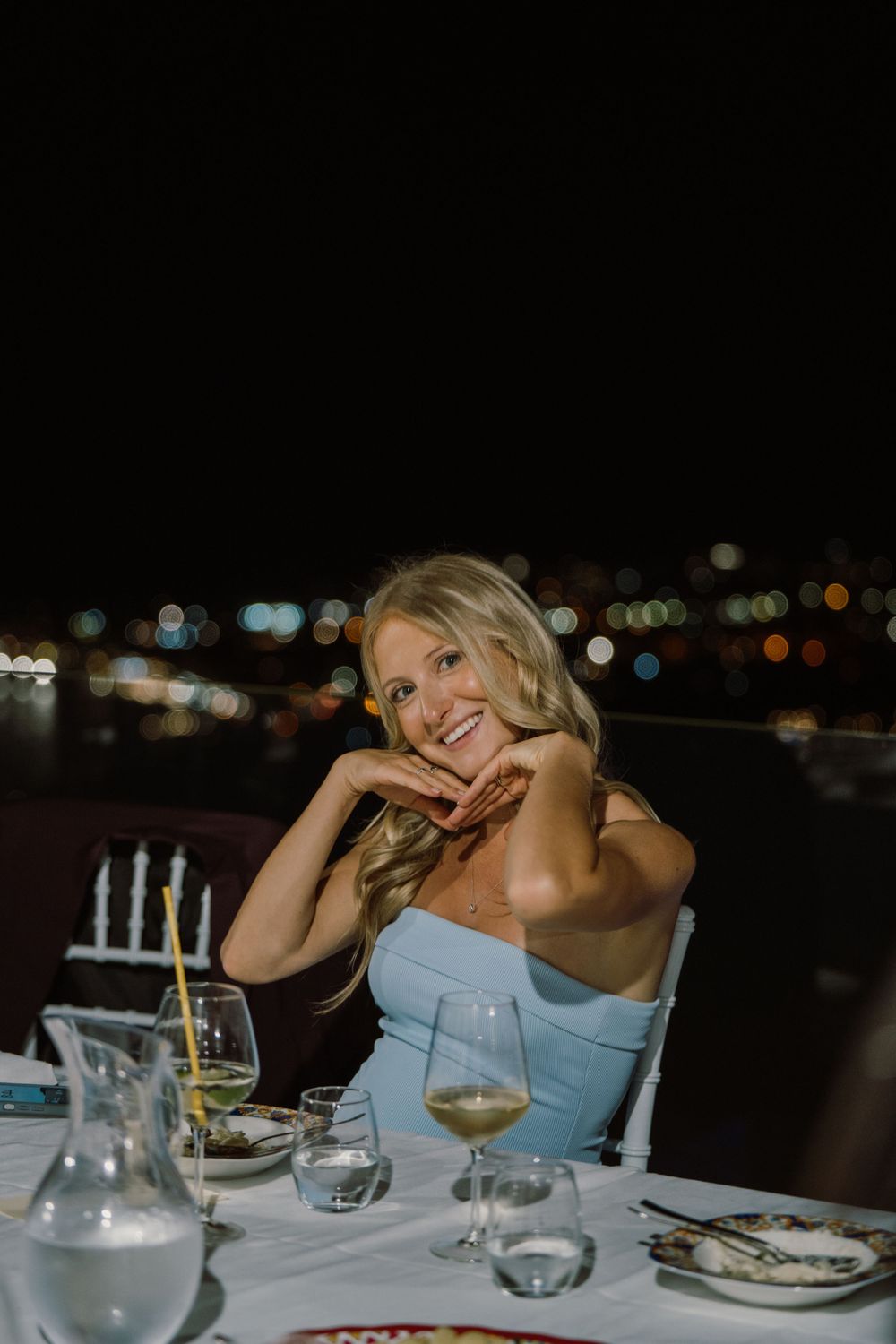 A happy wedding guest captured by a Italy wedding photographer