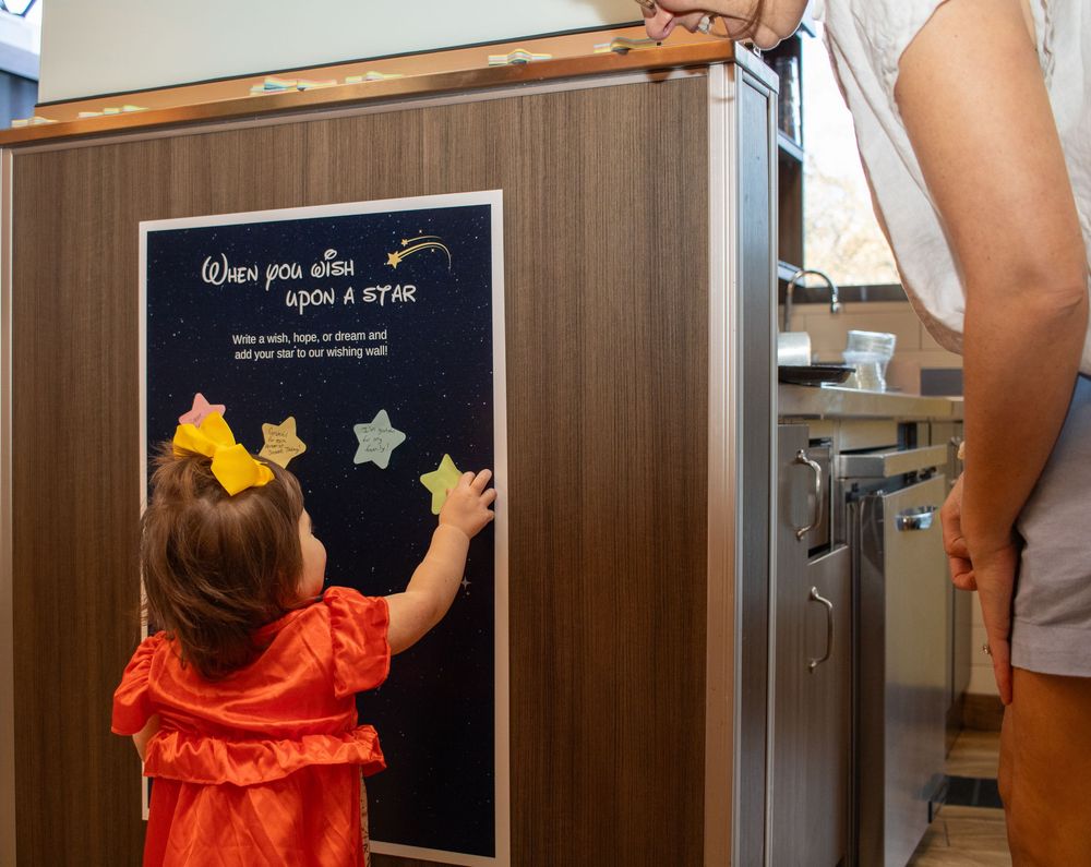 young girl interacting with stickers