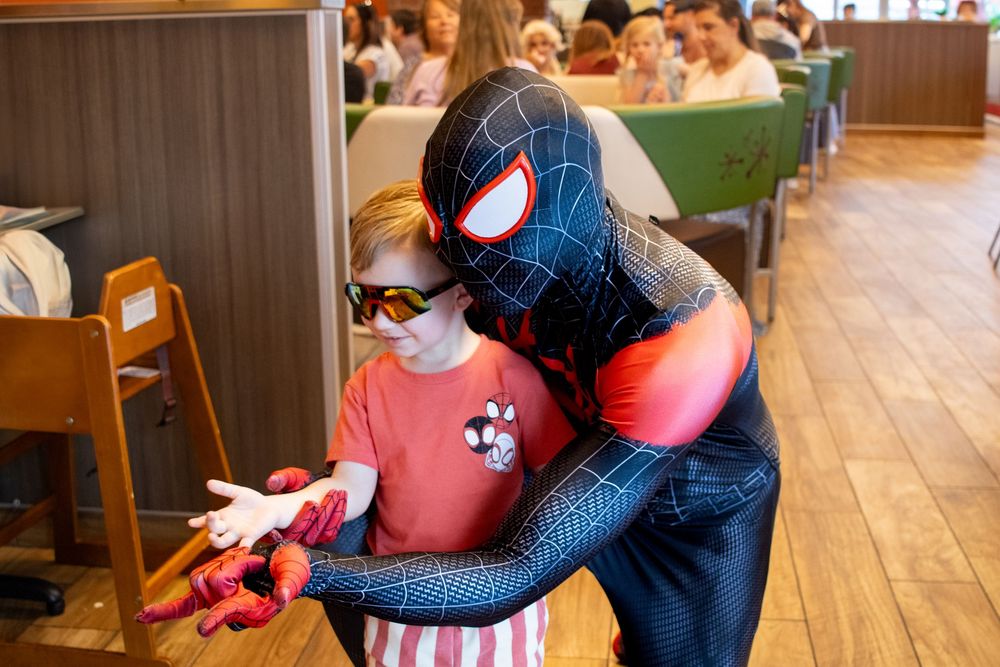 superhero playing with children