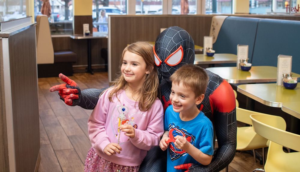 superhero playing with children