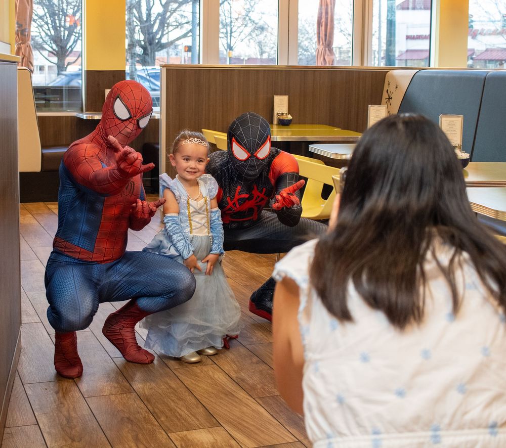 superhero playing with children