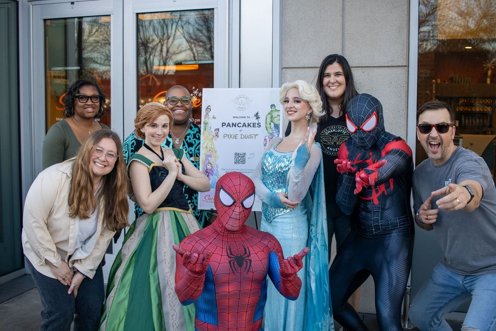 superhero group shot with the team