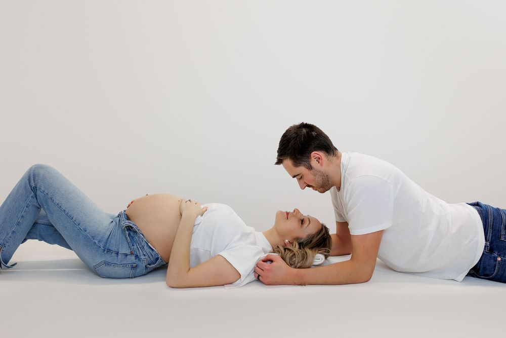 A series of profile views showing a sleeping person in white clothing lying on a white surface.