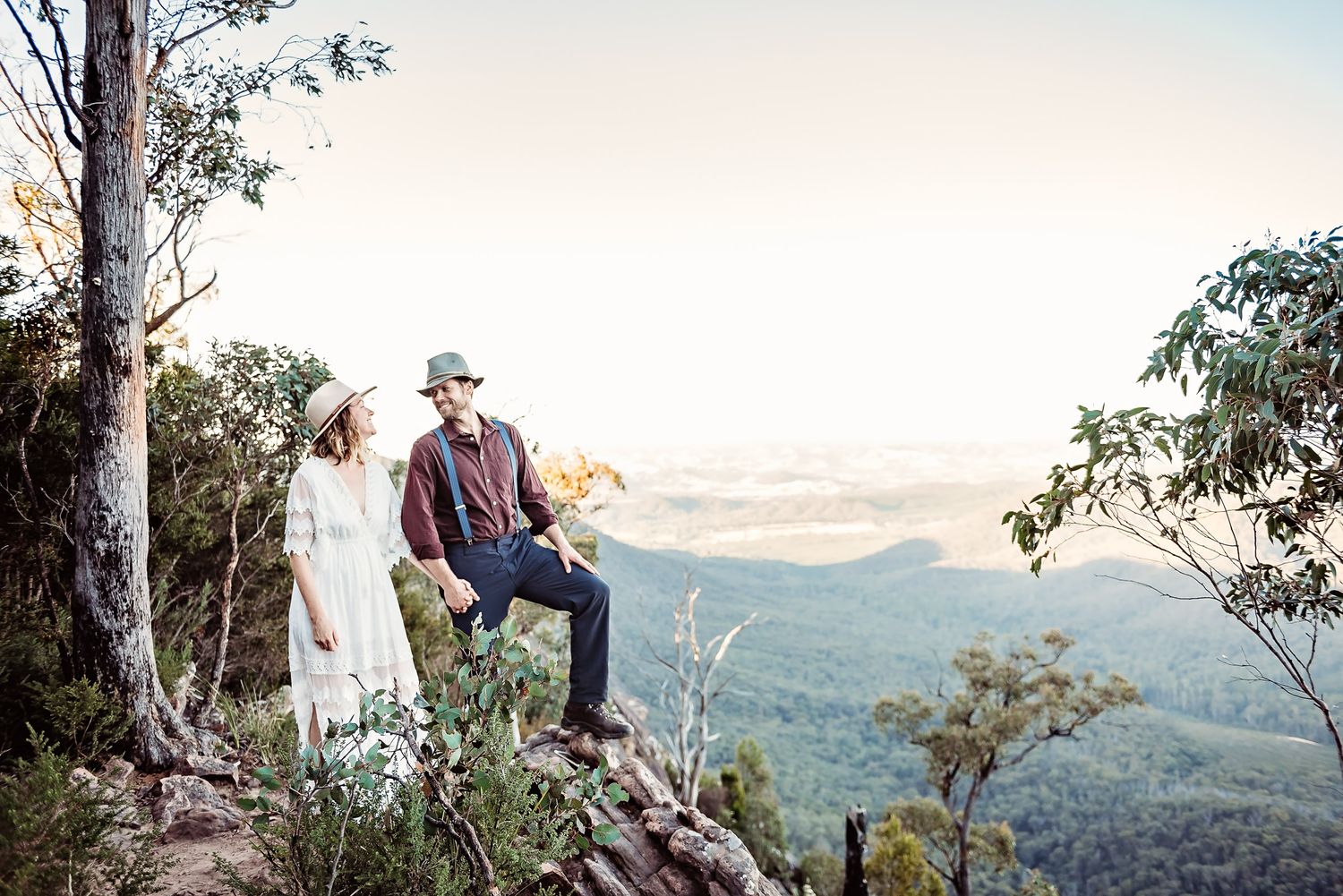 adventure photography session by joss jensen, tasmanian elopement photographer at the cathedral mountains at sunset