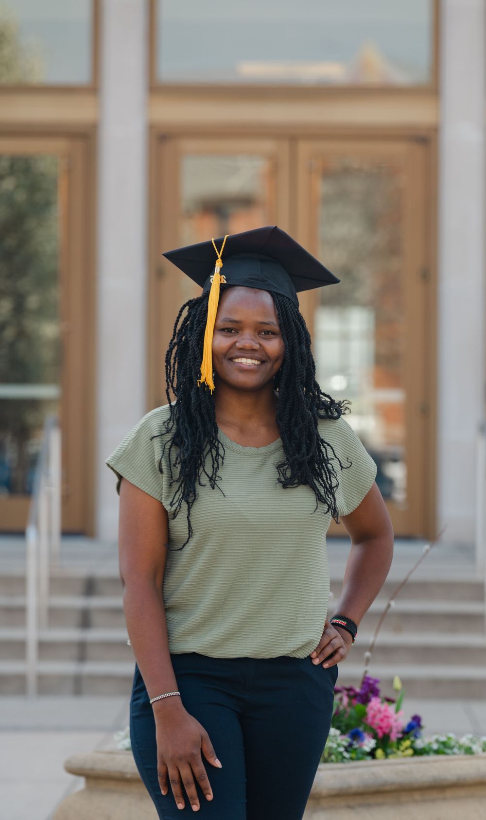 senior in front of building at GVSU