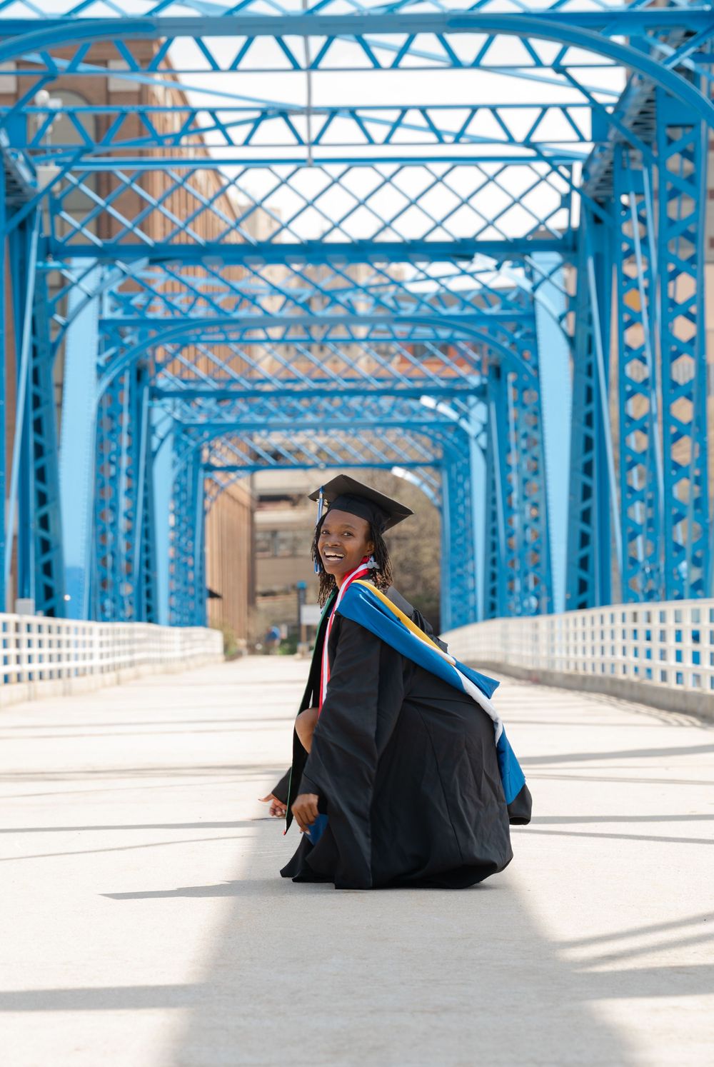 grad on blue bridge down town