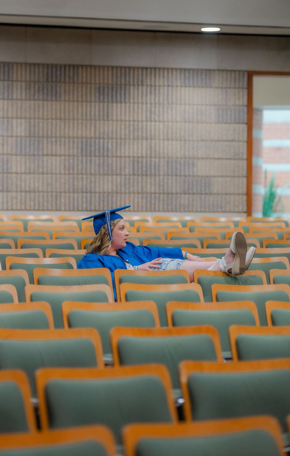 grad sitting in old school seats