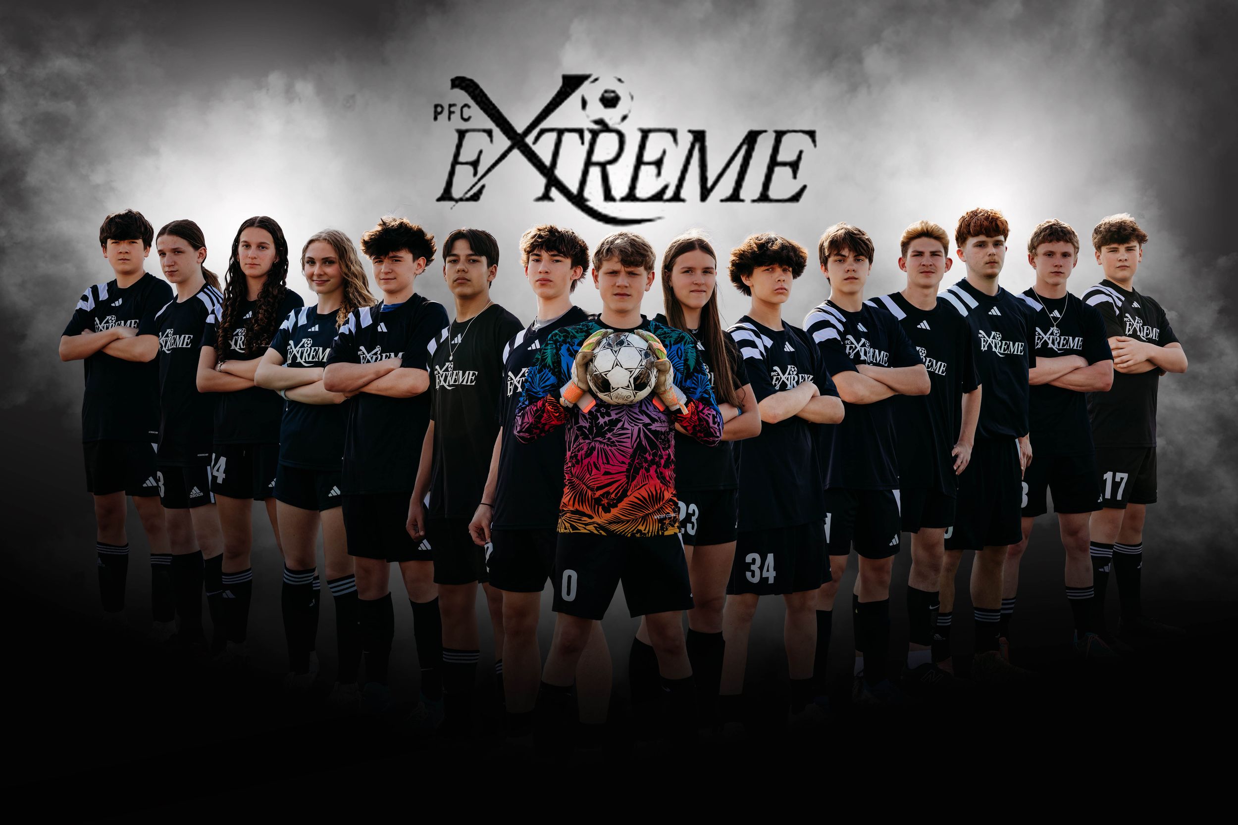 A dramatic team photo of athletes in black uniforms standing in a line against a dark stormy background.