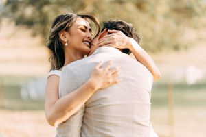 Romantic outdoor photo session with soft natural lighting and warm tones.