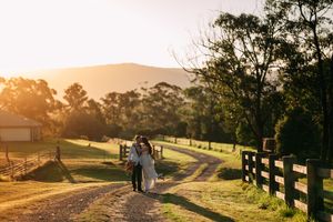 Scenic wedding venue overlooking rolling hills during golden hour.