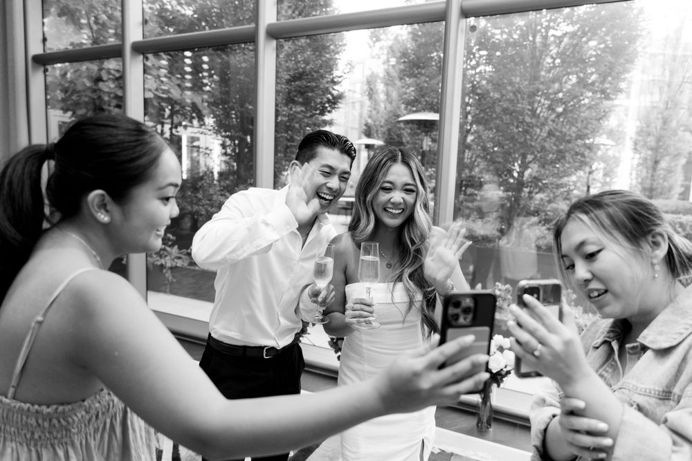 Friends gathered around a table sharing laughter and celebration.