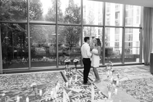 Bright indoor space with large windows showing celebration gathering.