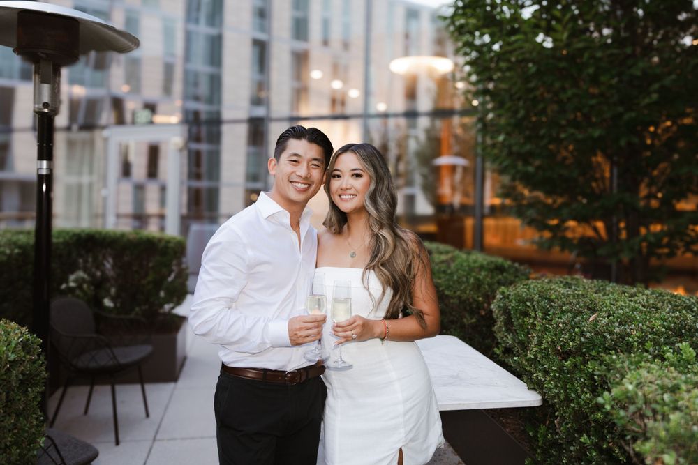 Romantic outdoor evening portraits with city buildings in background.