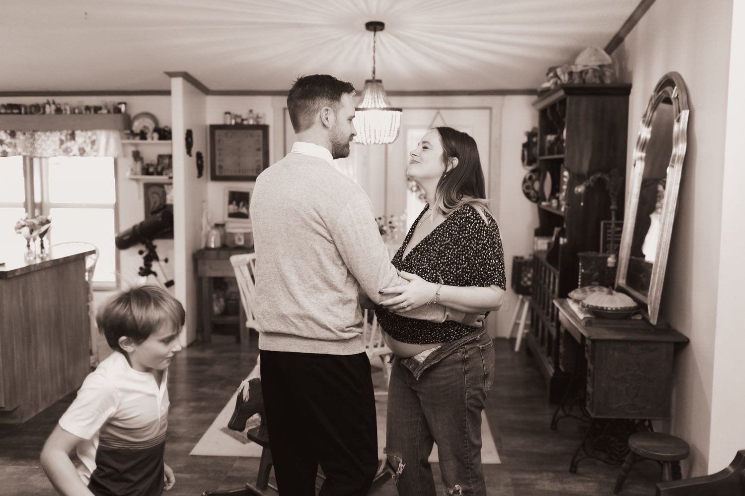 Couple embrace during a lifestyle shoot at their home near Middletown, OH. Photographed by Vicci Photo of Dayton, OH