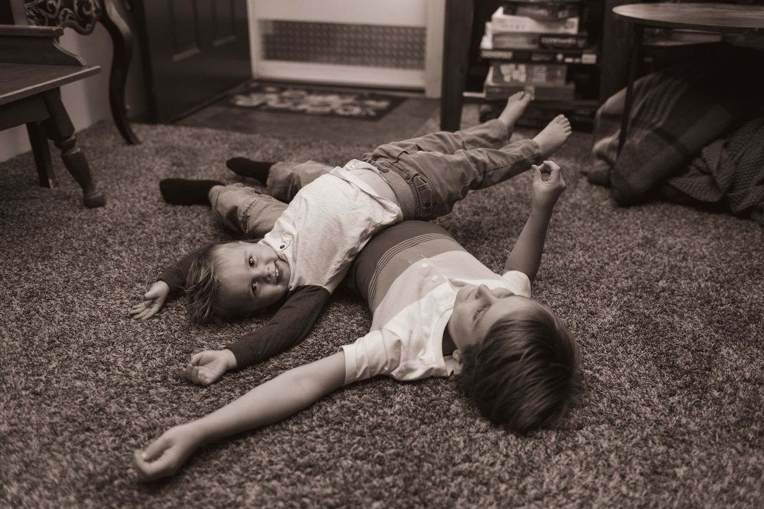 Children play in their living room during a lifestyle shoot at their home near Middletown, OH. Photographed by Vicci Photo of Dayton, OH