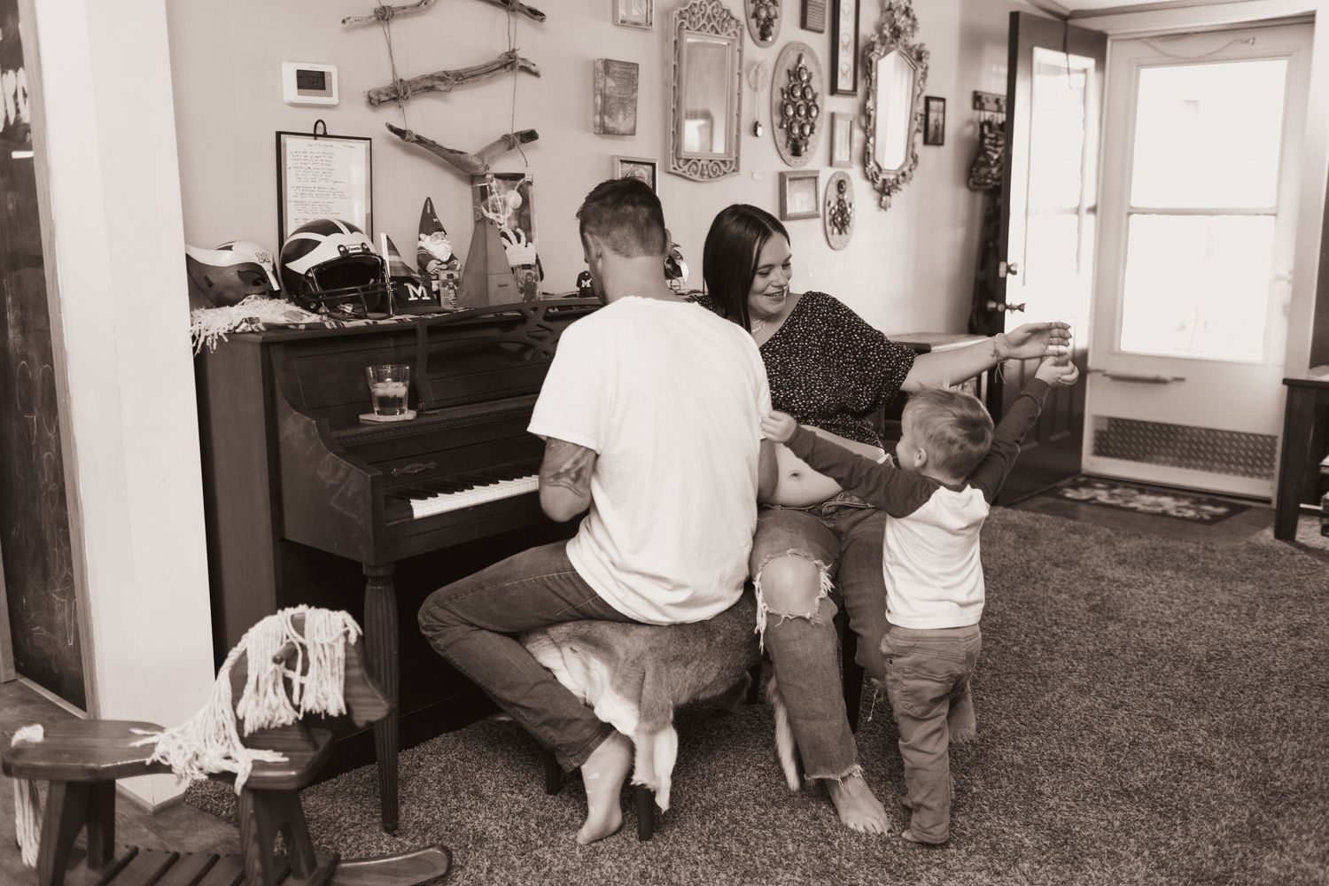 Family plays the piano during a lifestyle shoot at their home near Middletown, OH. Photographed by Vicci Photo of Dayton, OH