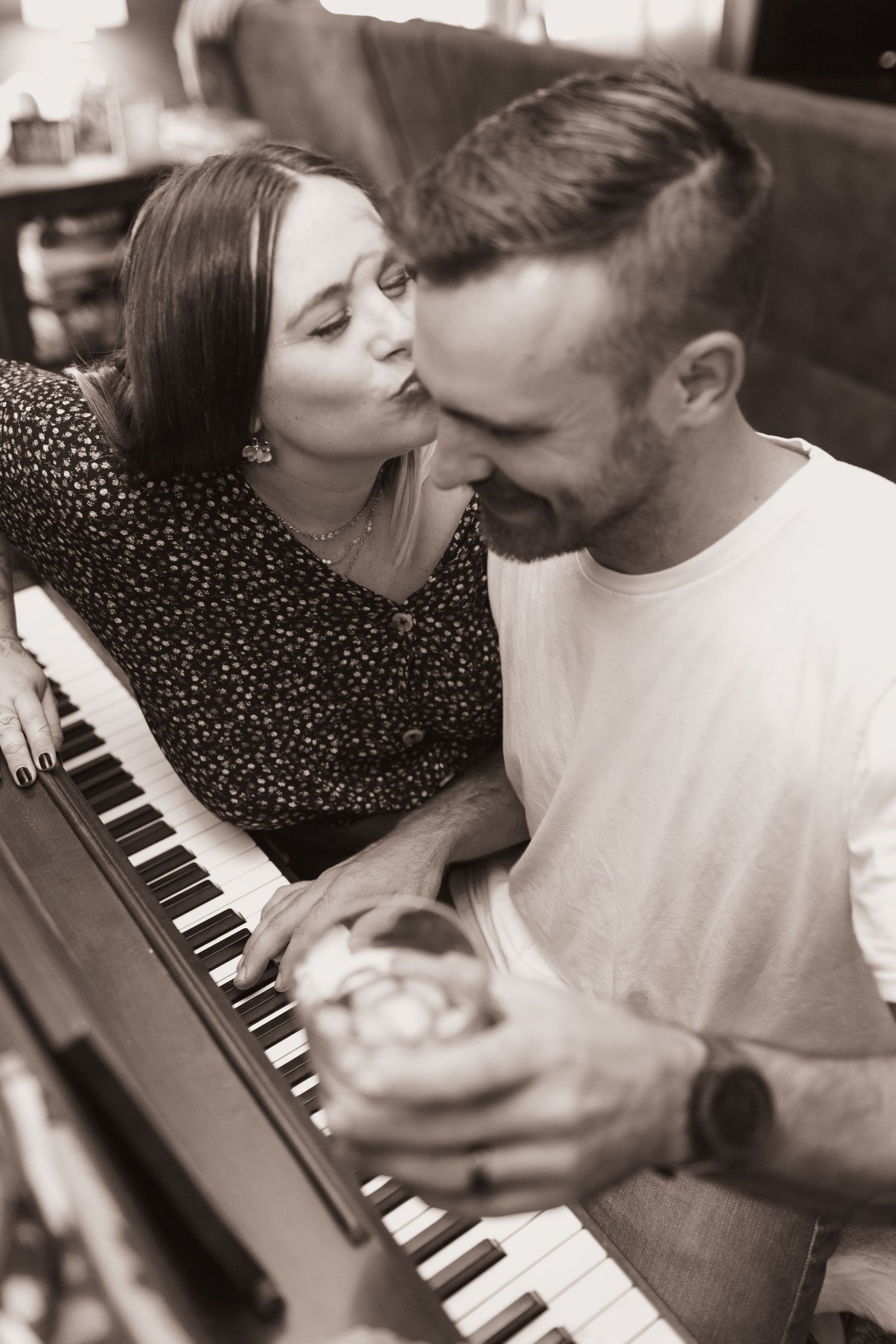 Family plays the piano during a lifestyle shoot at their home near Middletown, OH. Photographed by Vicci Photo of Dayton, OH
