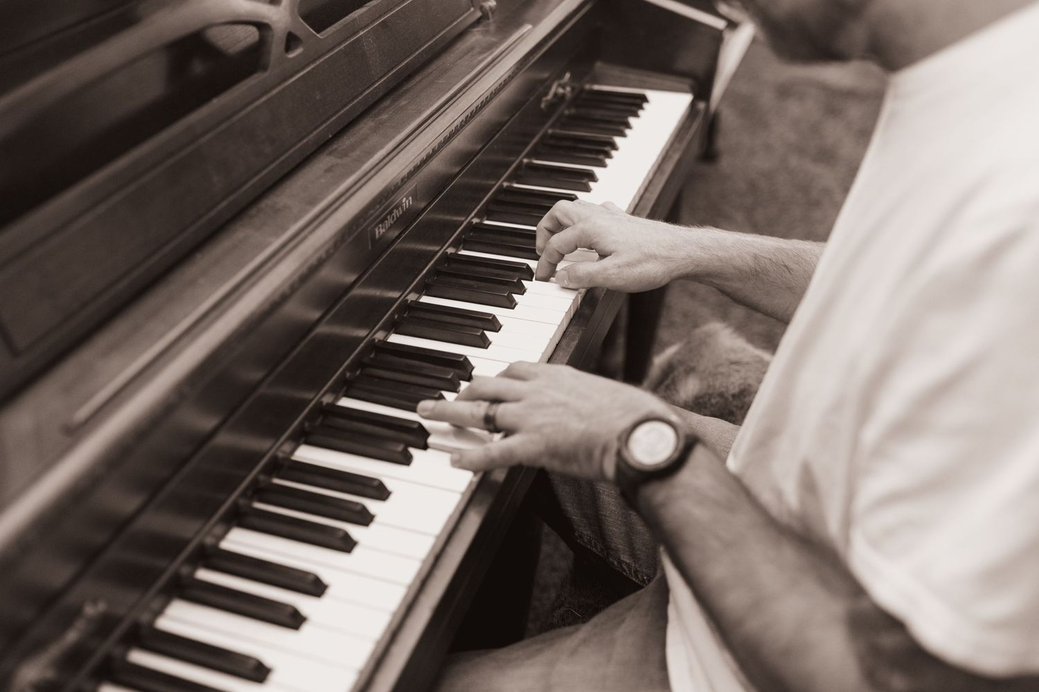 Family plays the piano during a lifestyle shoot at their home near Middletown, OH. Photographed by Vicci Photo of Dayton, OH