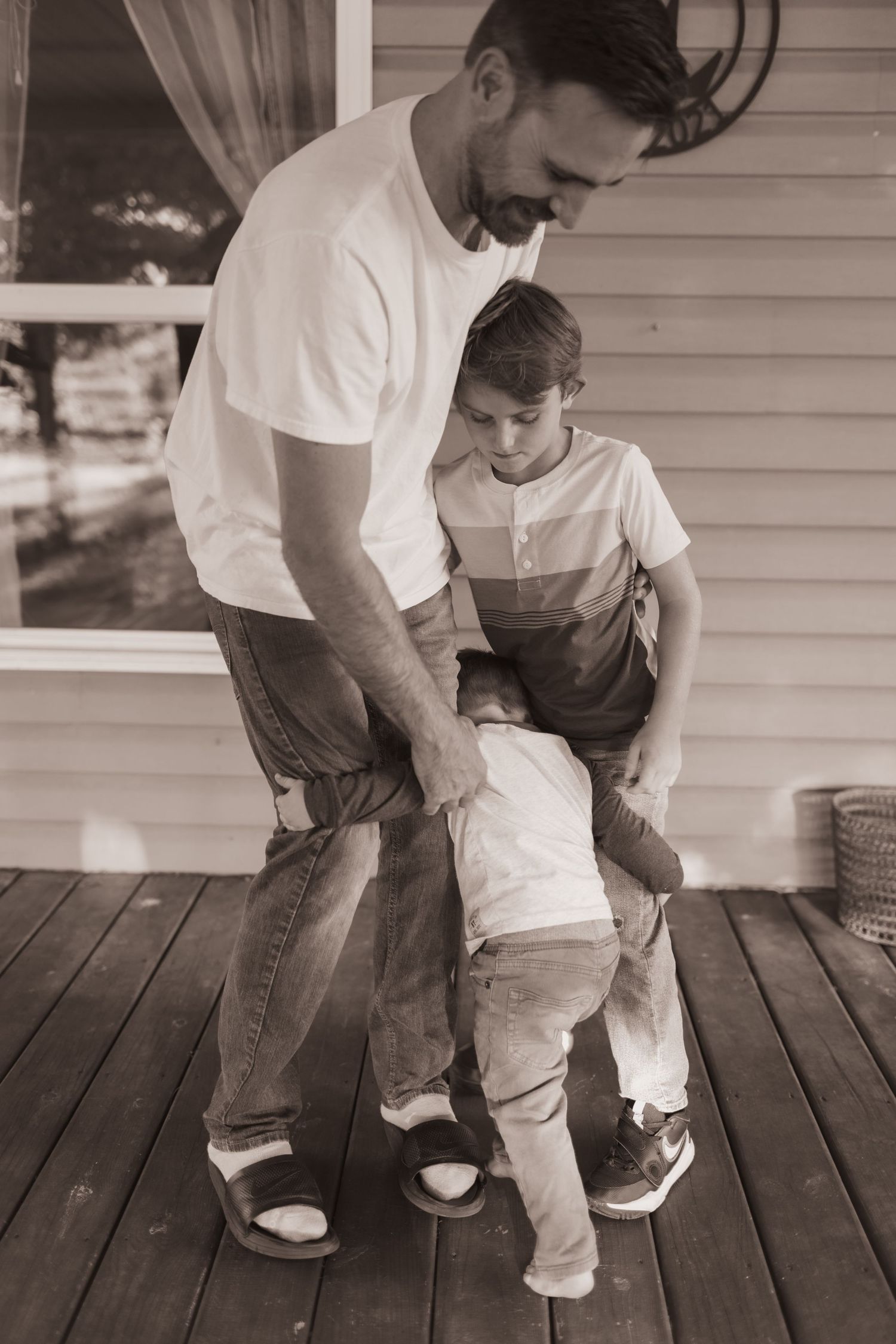 Father and sons play during a lifestyle shoot at their home near Middletown, OH. Photographed by Vicci Photo of Dayton, OH
